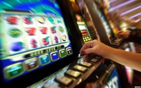 Filipino player selecting bingo cards on a mobile phone screen